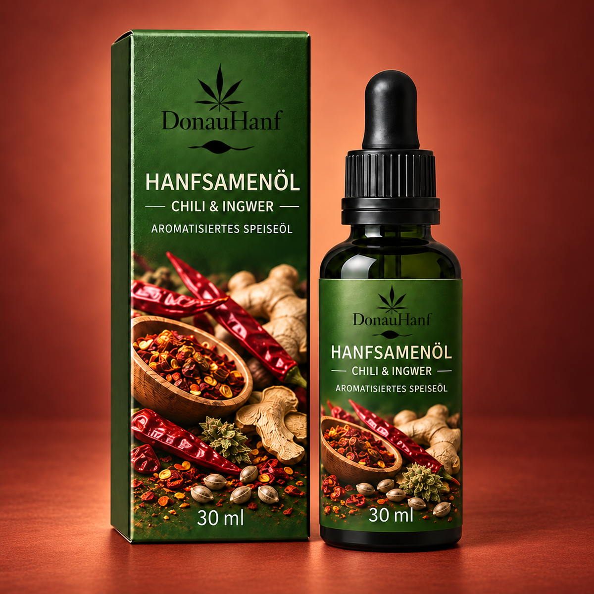 DonauHanf Hanfsamenöl Chili & Ingwer 30 ml – Verpackung und Flasche auf warmrotem Hintergrund